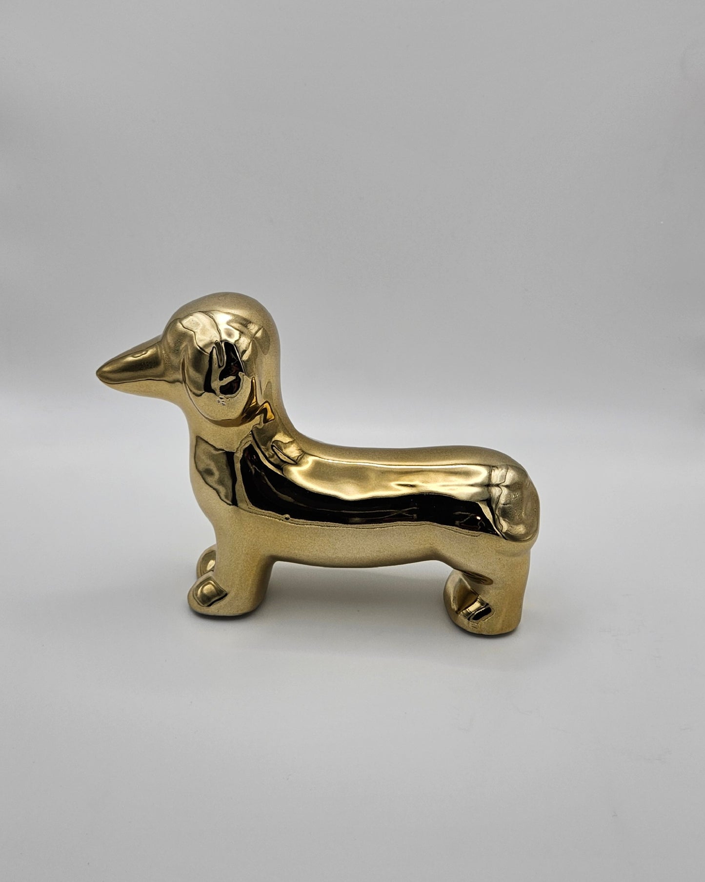 Kleiner goldener Deko-Dackel – glänzendes Deko-Highlight aus Keramik